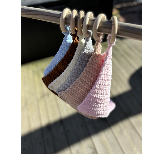 All comforters hung on a stick outside so you can see all the colours