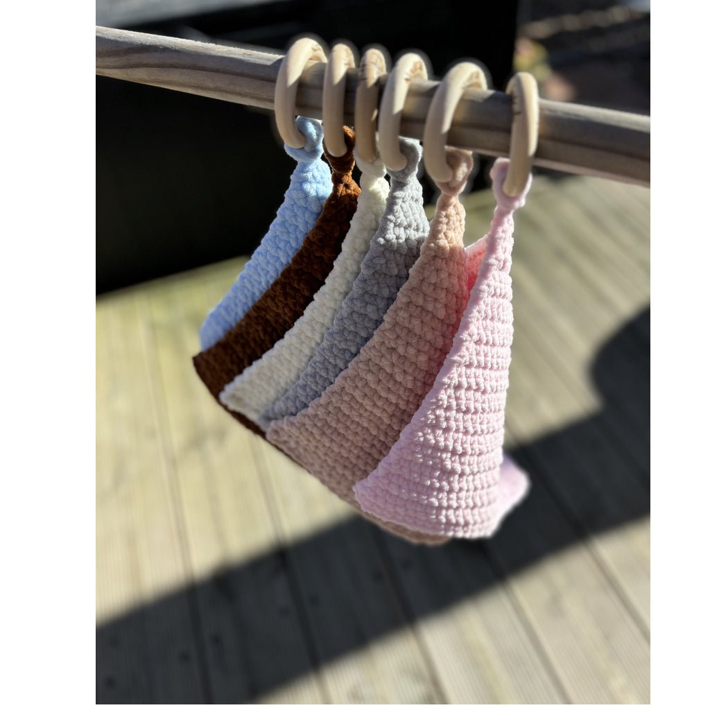 All comforters hung on a stick outside so you can see all the colours