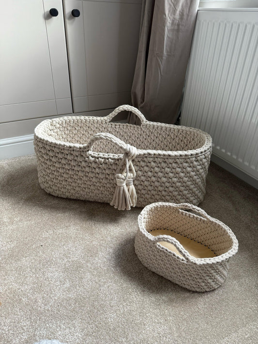 Two crochet baskets on a carpeted floor with a neutral background