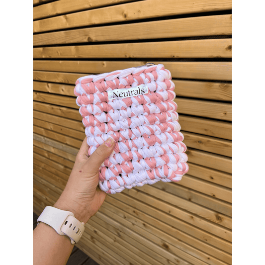 pink and white 6 inch kindle case handmade, crocheted by me with my neutrals logo sewn onto the front 
