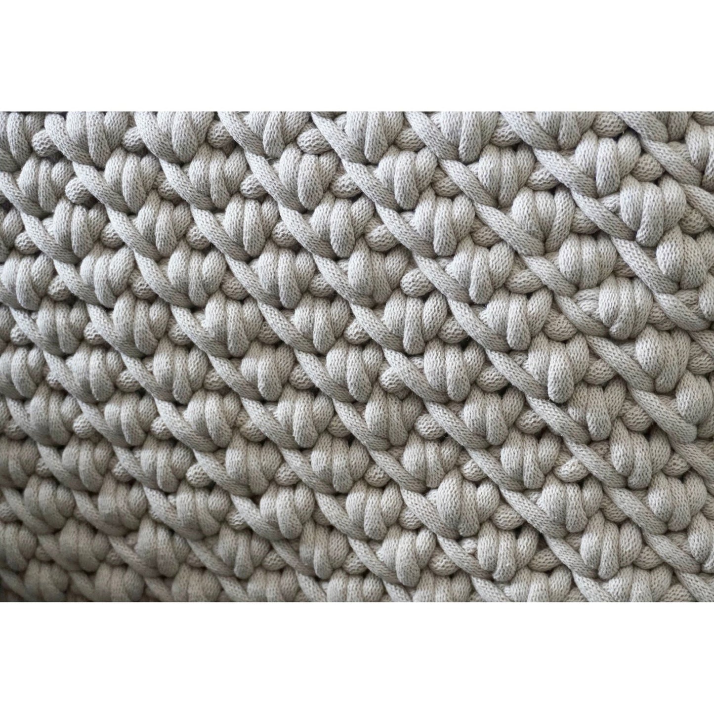 Extra close up of the pattern of the moses baskets in beige 
